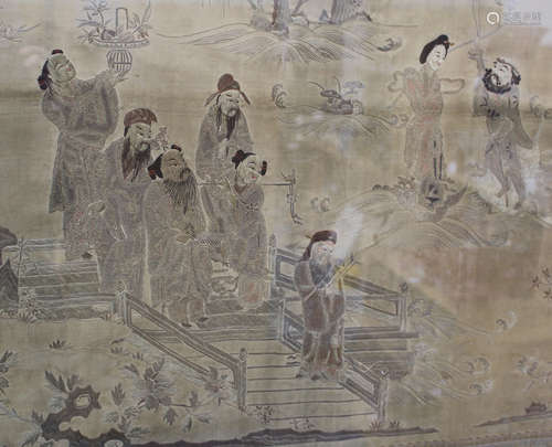 A Chinese silk embroidered table front panel, late 19th century, depicting the Eight Immortals and