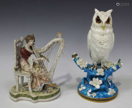 A Moore porcelain centrepiece, late 19th century, modelled as a white glazed owl, perched on a