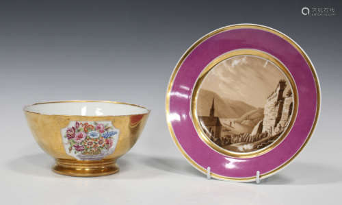 A Paris porcelain plate, circa 1830, painted in sepia colours with a landscape view of a