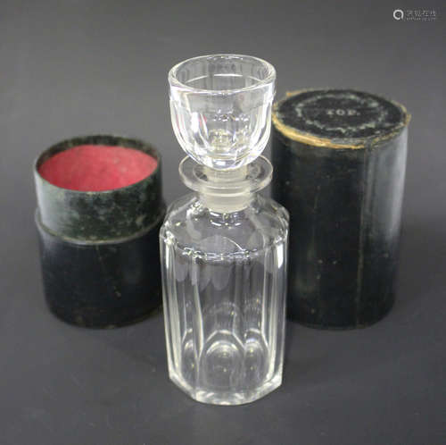 A cased travelling decanter, early 19th century, the octagonal faceted body fitted with a shot glass