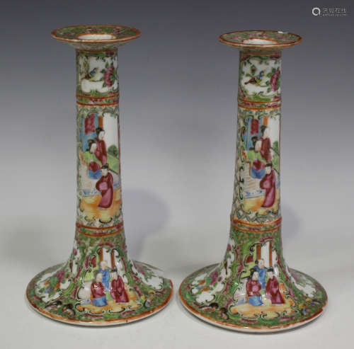 A pair of Chinese Canton famille rose porcelain candlesticks, late 19th century, each typically