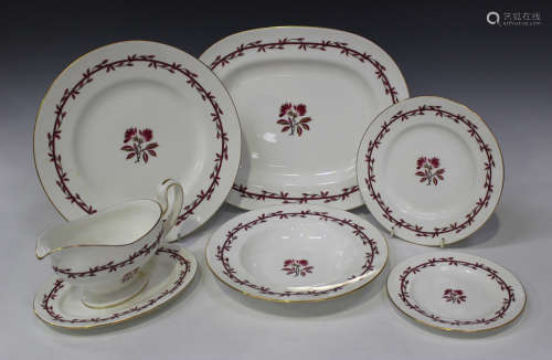 A Minton bone china 'Carmine' pattern part service, comprising two graduated platters, eight dinner,