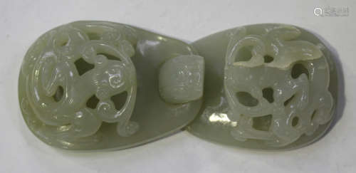 A Chinese pale celadon jade two section belt buckle, probably Qing dynasty, each piece carved and