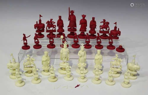 A Chinese Canton carved export ivory 'King George' chess set, early 19th century, the Chinese side