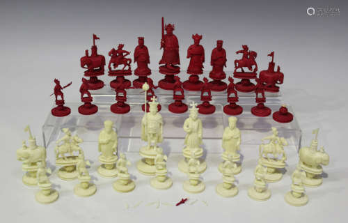A Chinese Canton carved export ivory 'King George' chess set, early 19th century, the Chinese side
