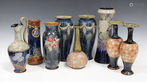 A mixed group of Royal Doulton stonewares, including a waisted cylindrical vase with rose decoration