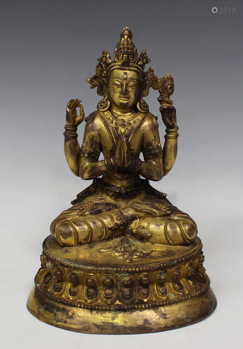 A Sino-Tibetan gilt bronze figure of Avalokitesvara, late Qing dynasty or later, the four-armed