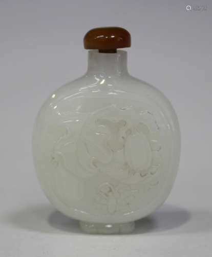 A Chinese white jade snuff bottle, 20th century, of flattened circular form, each side carved in low