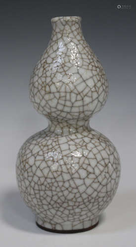A Chinese crackle glazed double gourd vase, 20th century, the pale grey glaze with all-over crackle,