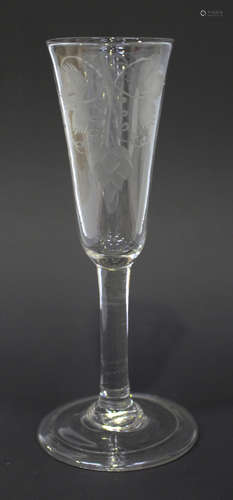 An engraved ale glass, circa 1770, the rounded funnel bowl engraved with hops and barley above the