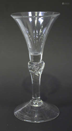 A balustroid wine glass, circa 1750, the trumpet bowl raised on a beaded inverted baluster stem