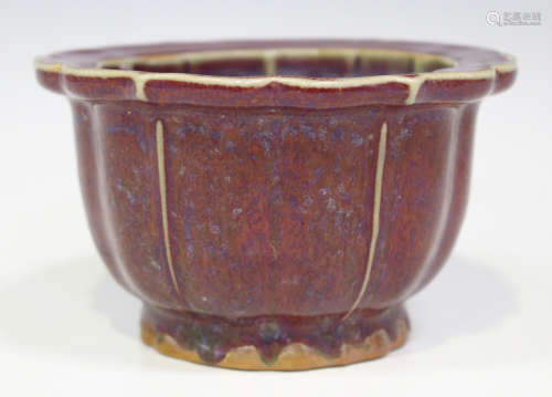 A Chinese flambé glazed planter, 20th century, of petal outline, covered in a purple and blue