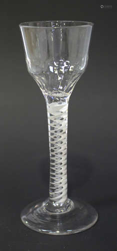 A double series opaque twist stem wine glass, circa 1770, the ogee bowl moulded with basal flutes