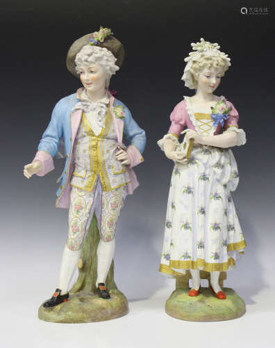 A pair of Continental bisque porcelain figures, probably French, late 19th century, modelled as an