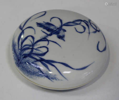 A Chinese blue and white porcelain circular box and cover, the top painted with a bird and reeds,