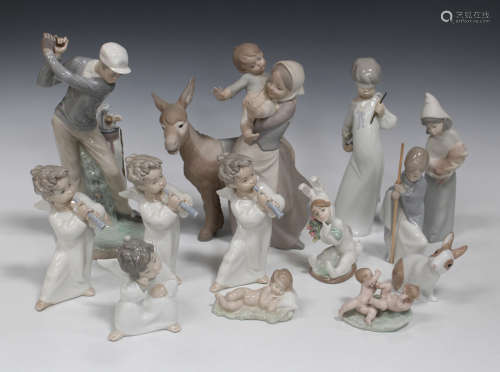A Lladro bisque porcelain figure Donkey Ride, No. 4843, three Lladro angels with a horn, No. 4540, a