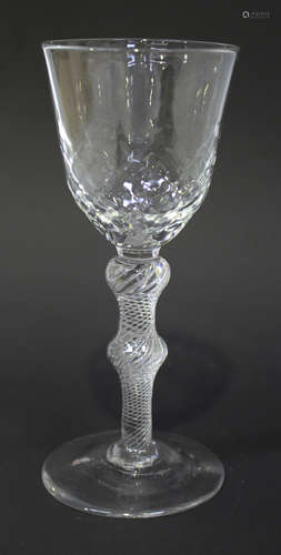 An airtwist stem wine glass, circa 1750, the pointed roundel funnel bowl moulded with a diamond