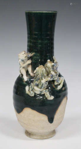 A Japanese Sumida pottery vase, Meiji period, the green trailed glaze neck applied with a monkey and