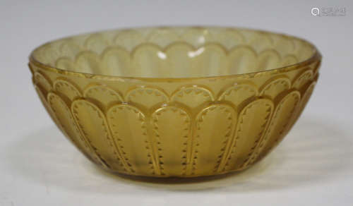 An Art Deco Lalique amber tinted circular glass bowl, 1930s, relief moulded with the Jaffa