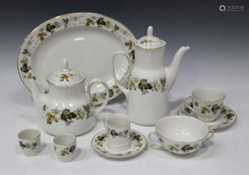 A Royal Doulton 'Larchmont' pattern part service, comprising three oval platters, cake plate, coffee