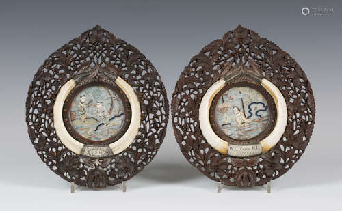 A pair of Chinese silk embroidered circular miniature panels, late 19th century, each worked in