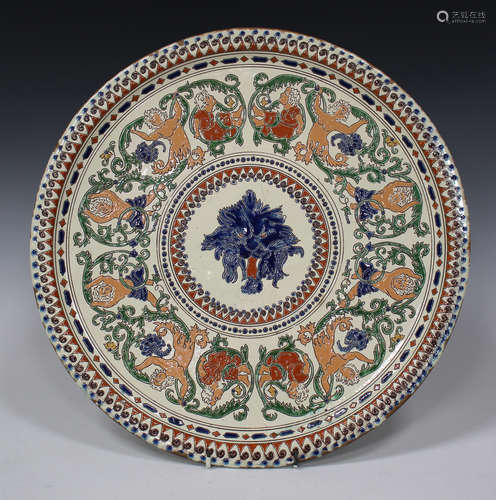 A Thoune pottery charger, late 19th/early 20th century, centrally decorated with a lion's head