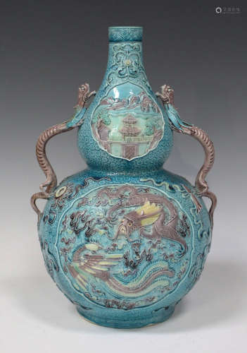 A Chinese turquoise and aubergine enamelled biscuit porcelain double gourd shaped vase, mark of