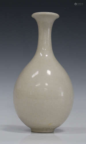 A Chinese white glazed porcelain vase, 20th century, the ovoid body with flared narrow neck, covered
