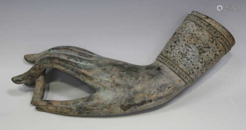 A South East Asian bronze hand, 20th century, modelled in vitarka mudra, length 27cm.Buyer’s Premium