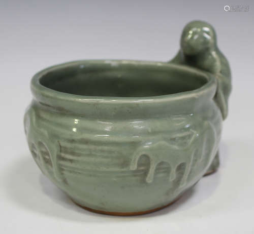 A Chinese celadon glazed porcelain bowl, probably late Qing dynasty, of circular form with moulded