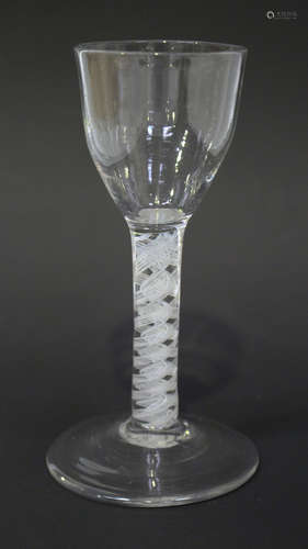 A double series opaque twist stem wine glass, circa 1770, the ogee bowl raised on a plain stem