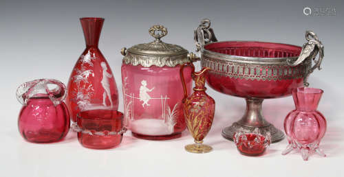 A collection of cranberry glassware, late 19th century and later, including a small ewer, possibly
