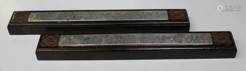 A pair of Chinese hardwood scroll weights, modern, of rectangular form, each top inset with a plated