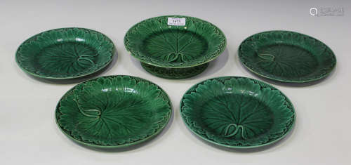 A group of green glazed majolica leaf moulded plates, late 19th century, including thirteen Wedgwood