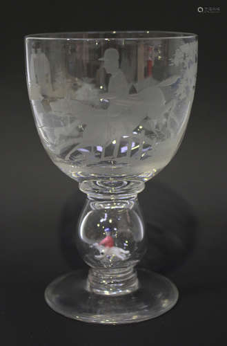 A Stevens & Williams engraved glass goblet by William Swingewood, 1930s, the rounded bowl engraved