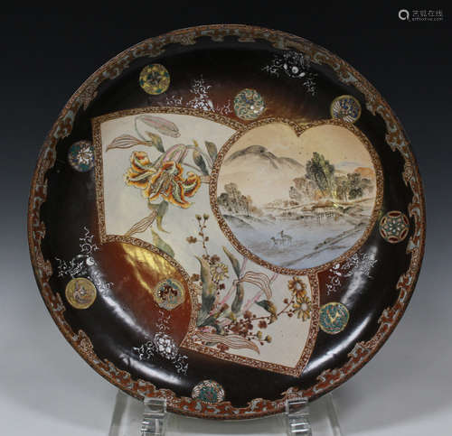 A Japanese Satsuma earthenware circular dish, Meiji period, the interior painted with two fan shaped