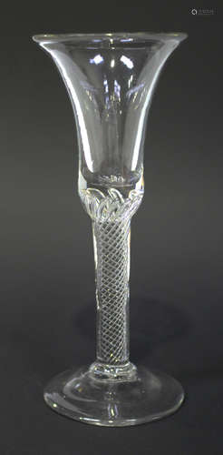 An airtwist stem wine glass, circa 1750, the bell bowl raised on a multi series airtwist plain