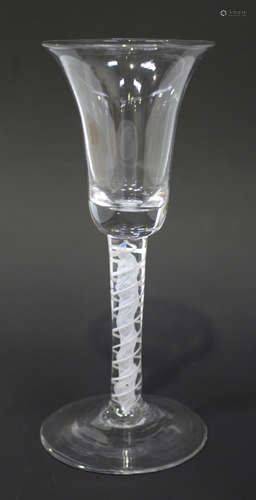 A double series opaque twist stem wine glass, circa 1770, the bell bowl raised on a plain stem