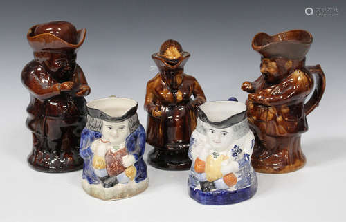 A group of Staffordshire pottery Toby jugs, 19th century and later, including treacle glazed