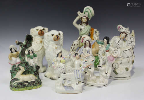A group of Staffordshire pottery figures, late 19th/early 20th century, one modelled as two children