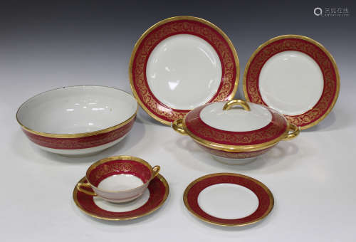 A C.H. Field Haviland Limoges porcelain part service, decorated with a puce band enriched in gilt,
