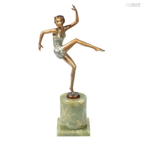 SIGNED IN CAST, CIRCA 1925 an art deco patinated bronze study of a dancing girl in silvered costume by josef lorenzl