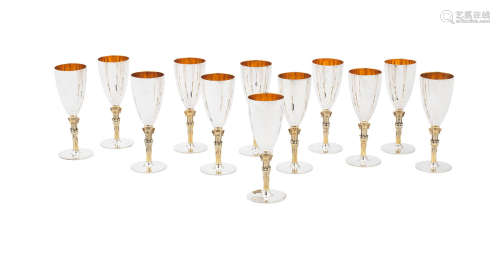 by C J Vander Ltd,  London 1981  (12) A set of twelve silver and silver-gilt commemorative champagne goblets
