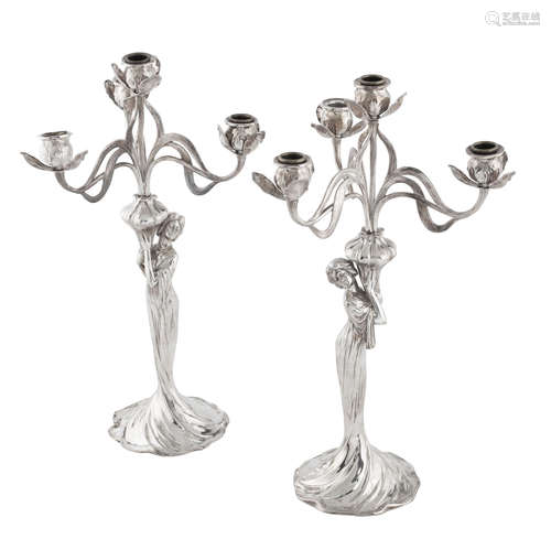 STAMPED MAKER'S MARKS, CIRCA 1900 a pair of WMF figural plated pewter art nouveau candleabra