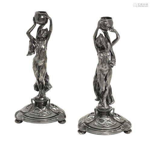 STAMPED MAKER'S MARKS, CIRCA 1900 a pair of wmf art nouveau pewter figural candlesticks