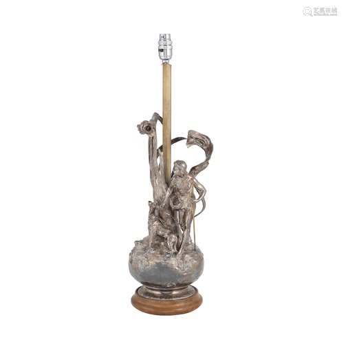 MARKS OBSCURED BY WOODEN BASE, CIRCA 1900 a pewter figural lamp, attributed to WMF