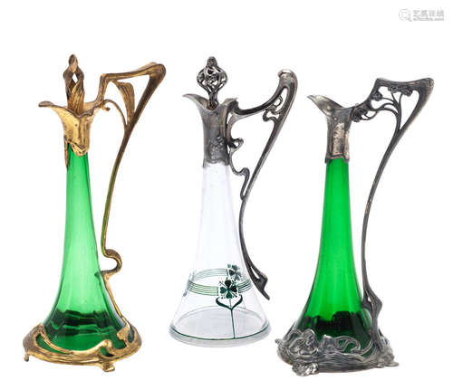 STAMPED MAKER'S MARKS, CIRCA 1900  a wmf figural pewter art nouveau decanter with green glass liner