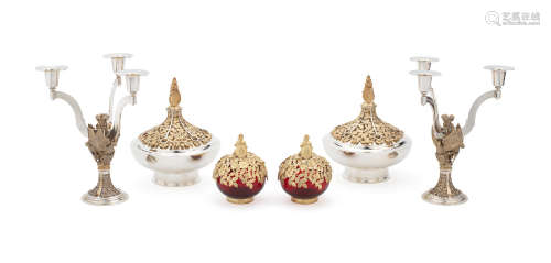 London 1981, limited edition numbered Commemorating the wedding of Prince Charles and Lady Diana Spencer; a pair of silver and silver gilt 'Bowes Lyon' commemorative covered taperstick bowls, Hector Miller for Aurum, London 1986; a pair of silver-gilt commemorative 'Ruby Wedding Queen Elizabeth II and Duke of Edinburgh' red glass covered pot pourri bowls, Hector Miller for Aurum, London 1988 (6) HECTOR MILLER FOR AURUM: A pair of silver and silver-gilt commemorative Royal Wedding three-light candelabra