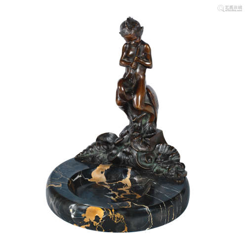 SIGNED IN CAST, CIRCA 1925 an art deco patinated bronze study of a young sea sprite riding a pelican by f.rieder
