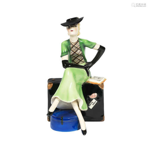 MAKER'S MARKS, CIRCA 1925 A Goldscheider art deco ceramic model of a woman seated on suitcase by Dakon